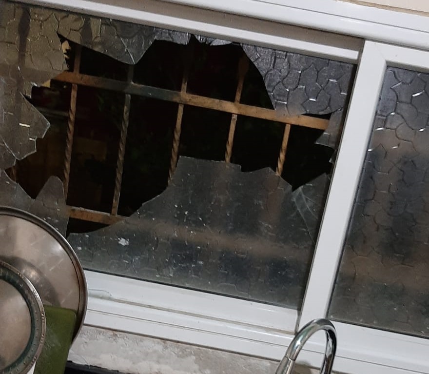 Broken window in the Hamed's family home. Photo courtesy of family