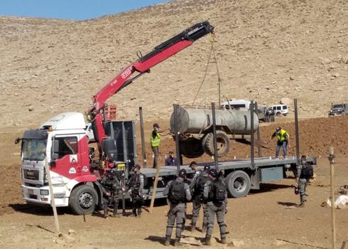 Confiscation of mobile water container in the al-Qabun area. Photo by Iyad Haddad, B'Tselem, 14 July 2021