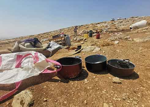 The family’s belongings after the demolition in al-Qanub. Photo by Nasser Nawaj’ah, B’Tselem, 4 August 2021