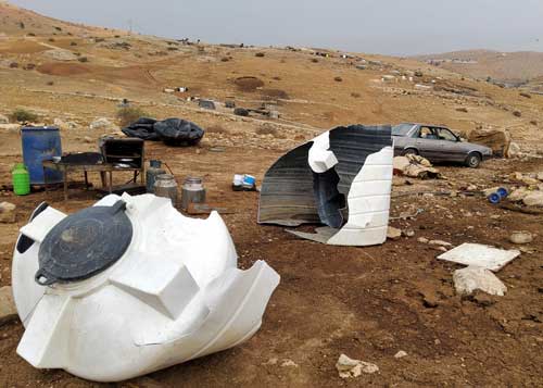 The water tanks destroyed by Civil Administration personnel. Photo by ‘Aref Daraghmeh, B’Tselem, 1 Nov. 2021 