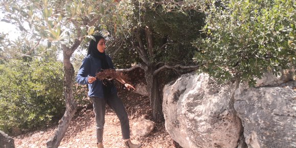 Fidaa ‘Ataya where the art workshop once stood. Photo by Iyad Hadad, B’Tselem, 13 Sep. 2021 