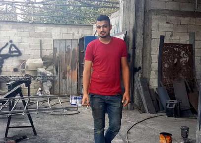 Muntasser a-Najar in his family’s metal workshop. Photo courtesy of the witness.