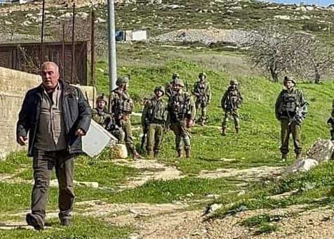 Hafez Saleh walking away from the soldiers after being released. Photo courtesy of local residents. 