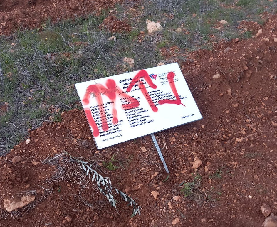 Slogans spray-painted by the settlers in the olive grove. Photo courtesy of the farmers  