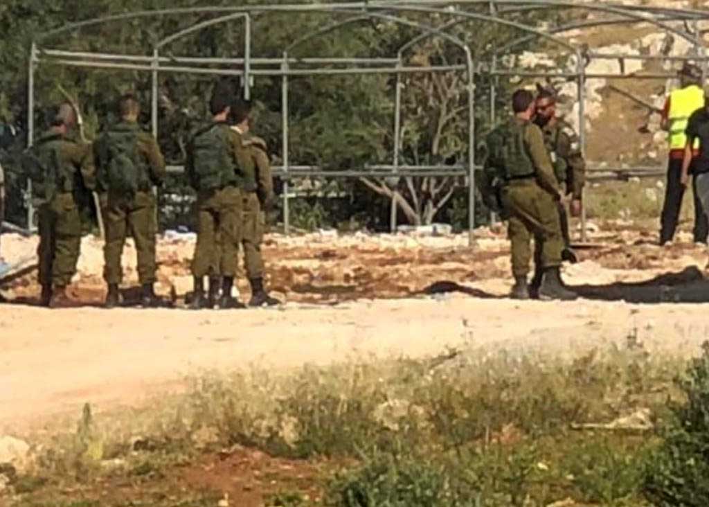 Confiscation of tentes set up as temporary classrooms in Jub a-Dib. Photo by Nasser Nawaj'ah, B'Tselem, 10 May 2023