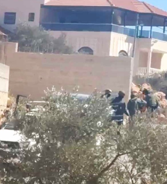 Soldiers beating a resident of Turmusaya that was taken out of a car. Stills from video courtesy of residents