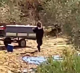 Settler next to a-Ziben’s trailer. Still from video footage, courtesy of the witness 