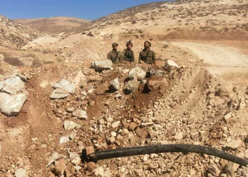 Destruction of the road and water line. Photo by Nasser Nawaj'ah, B'Tselem, 23 June 2021