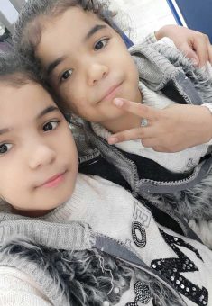 Razan Barbakh with her twin sister Rawan before the war. Photo courtesy of the family