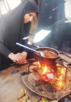 Kifah al-Hasanat doing housework in her family’s tent. Photo courtesy of al-Hasanat 