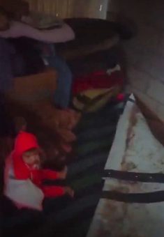 Kinaz, Muna and Fahed Hassan’s infant daughter, in the flooded tent. Photo courtesy of the family