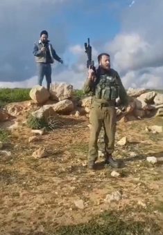 Luria Luski after the shooting, and his brother Shem Tov behind him. From video footage courtesy of the family 