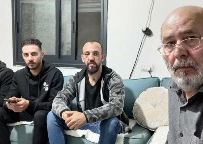 Rabah Abu al-Hummus with his sons Bilal, Sultan and Muhammad after their release from detention. Photo by ‘Amer ‘Aruri, B’Tselem, 24 Nov. 2021