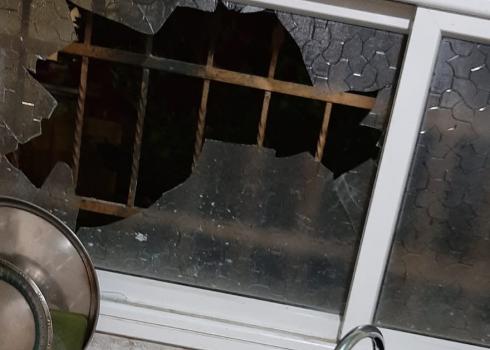 Broken window in the Hamed's family home. Photo courtesy of family