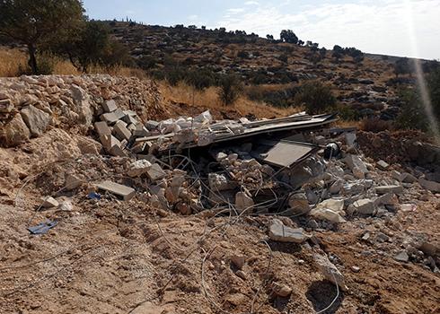Ruins of the family's home in Birin. Photo courtesy of community resident