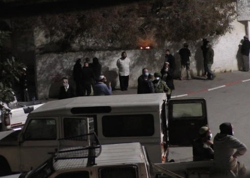 Jewish worshippers gather in the streets of Kifl Hares on the night a house window and car windows were smashed, 1 Feb.2021 