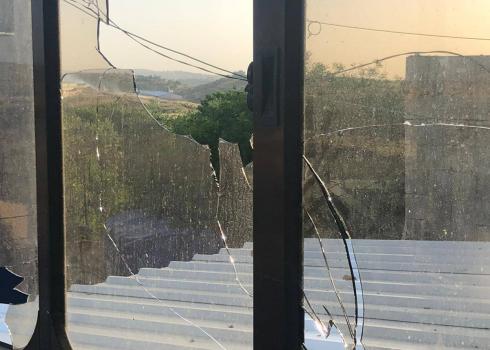 Window in Qusrah home shattered by settlers. Photo courtesy of the residents