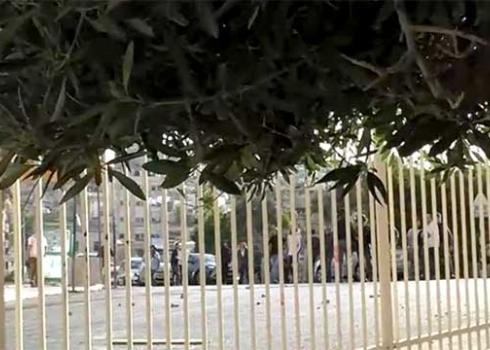 Settlers throwing stones at the Geith neighborhood across the fence. Photo by Nael Fakhuri, 11.5.21