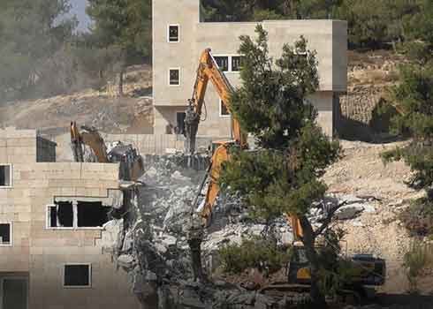 Demolition of homes in the town of Sa’ir. Photo by Nasser Nawaj’ah, B’Tselem, 5 August 2021