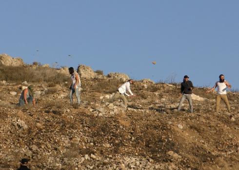 Settlers throwing stones at the ‘Eid family home. Photo courtesy of the family. 