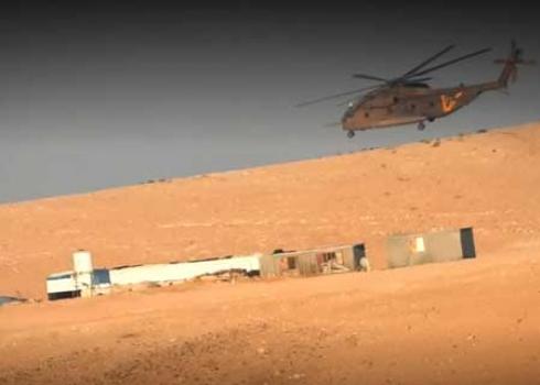 Military helicopter flying over Khirbet al-Maghaz during combat training in Masafer Yatta. Photo by Nasser Nawaj’ah, B’Tselem, 27 June 2022