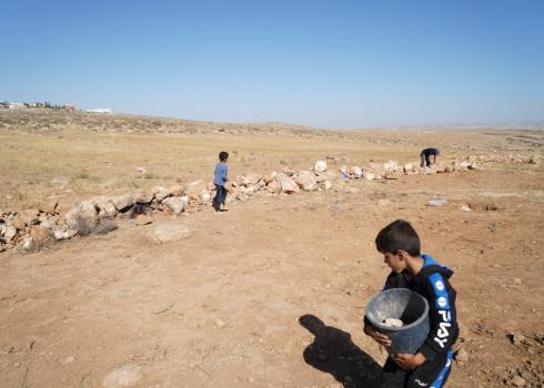 Sa’id ‘Awad and his children restoring the fence. Photo by Omri Eran Vardi, 4 June 2022 