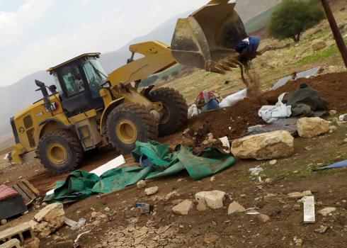 Demolition of one of the structures in the community of Lifjim. Photo courtesy of the residents 