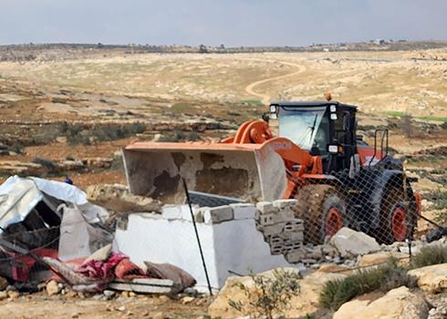 Agricultural structure being demolished in She'b al-Batem. Photo: Nasser Nawaj'ah, B'Tselem, 15 Feb. 2023 