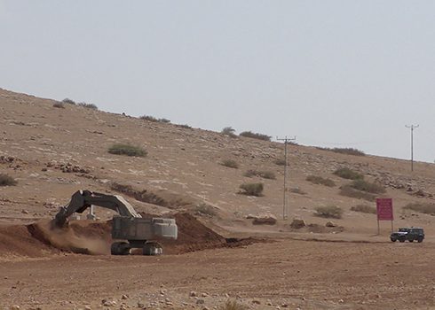 An Israeli military D9 bulldozer digs a trench in farmland. Photo by ‘Aref Daraghmeh, B’Tselem, 15 August 2023. 