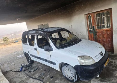 The Shnaran family’s car after it was set on fire by settlers. Photo: Nasser Nawaj’ah, B’Tselem