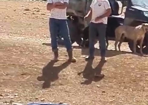 The settlers at the entrance to Bsharat’s home. Photo courtesy of the family