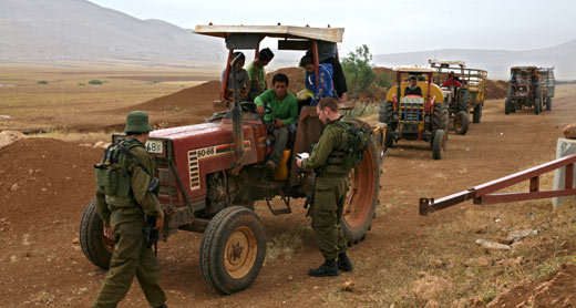 Soldiers detain farmers on dirt road leading to the towns Tammun and Tubas, west of the Jordan Valley. Photo: Keren Manor, activestillos.org, 28 April 2011 Soldiers detain farmers on dirt road leading to the towns Tammun and Tubas, west of the Jordan Valley. Photo: Keren Manor, activestillos.org, 28 April 2011