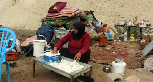 Mushakhis Bani Maniya of Khirbet 'Ein Karzaliyah , making cheese, Photo: ‘Atef Abu a-Rub, B'Tselem, 13 January  2014