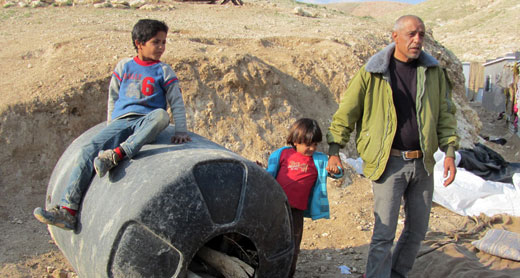 Community leader Muhammad Ka’abneh and two of his sons. Photo: 'Amer al-Aruri, B'Tselem, 18 Jan. 2015. Click on photo to enlarge