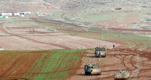 Military tanks in fields cultivated by the community, partially seen in the top-left corner. Photo by ‘Aref Daraghmeh, B'Tselem, 27 Jan. 2016