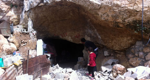 Residents of Khirbet Tana near entrance to residential cave demolished by the authorities. Photo by Abdulkarim Sadi, B’Tselem, 2 Mar. 2016 Residents of Khirbet Tana near entrance to residential cave demolished by the authorities. Photo by Abdulkarim Sadi, B’Tselem, 2 Mar. 2016