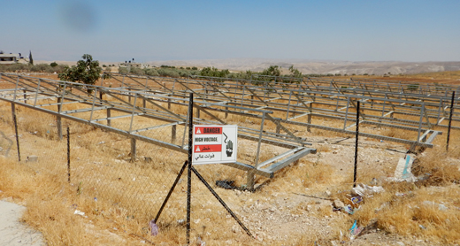 The stands from which the confiscated solar panels were removed. Photo: Manal al-Ja'abari, B'Tselem, 29 June 1997 The stands from which the confiscated solar panels were removed. Photo: Manal al-Ja'abari, B'Tselem, 29 June 1997